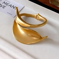 Matte gold leaf-shaped wide arm cuff bracelet with elegant spring hinge closure - Gold Matte Leaf Wrap Style
