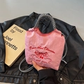 Pink nylon tote bag featuring cherry embroidery and black and white houndstooth rope handles - Pink