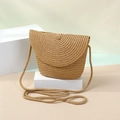 Detail of hand-woven straw crossbody bag with natural texture and beige geometric design - Small / Flap Bag / Brown