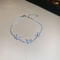 Detail of silver butterfly bracelet with sparkling zircon stones on leather background - Silver Butterfly