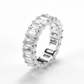 Macro view of emerald-cut clear zircons in a silver claw setting on the ring band - US 6 / Steel Color White Zircon