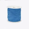 Detail of 0.8mm blue nylon braided cord neatly wound on a white spool for jewelry making - Color 374 Dark Blue