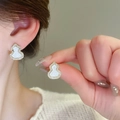 Detail showing gold-tone gourd earrings with white enamel inlay and sparkling rhinestones - 33# White Gold - Pave Rhinestone Wulu (Silver Earring Post)