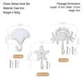 Three-piece ocean style cast iron hooks set featuring shell, starfish and crab shapes - Cast Iron / Marine Life Hooks 3-Piece Set