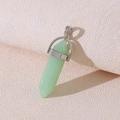 Natural green quartz hexagonal pillar pendant with silver metal bail on textured background - Green Jade