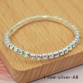 Single row silver bracelet with sparkling AB crystals on a wooden pedestal - 1 Row Silver AB Rhinestone Bracelet