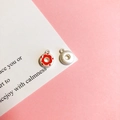 Detailed close-up of donut-shaped metal charms in silver and red enamel for jewelry DIY - 7# Strawberry Doughnut Matte Silver