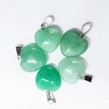 Five 15mm green natural stone heart pendants with silver metal clasps on white background - Green Aventurine