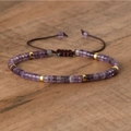 Adjustable woven bracelet with purple amethyst disc beads and golden metal spacers - No.28 Amethyst