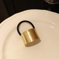 Minimalist black elastic hair tie featuring a polished gold metal tube clasp ornament - Ponytail Clip / Gold