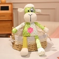 Cartoon patchwork sheep plush toy with colorful dots and stripes in a woven basket - Little Sheep
