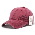 Detail of side embroidery on distressed burgundy baseball cap with brand tag - Burgundy