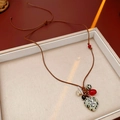 Detail of bohemian wax cord heart pendant with rustic wooden beads and silver cross - Spotted Stone Heart Cross Style