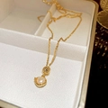Baroque freshwater pearl necklace with gold coin pendant and elegant thin chain - 18K Gold Plated Round Freshwater Pearl Necklace