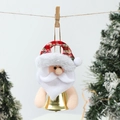 Detailed view of Santa plush bell ornament hanging on a rope with snowy trees backdrop - Santa Claus