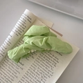 Elegant mint green pleated fabric hair claw clip for women on a stylish magazine - Cloud Hair Claw / Green