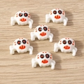 Detail of white plastic spider charms with orange markings for DIY Halloween jewelry - 10 Pieces Pack / Skull