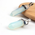 Opalite hexagonal point pendant with silver metal bail showing milky white gemstone - Opal