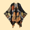 Detailed view of knit shawl featuring orange and black geometric patterns with deer motifs - Vintage Artifact Black Orange