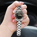 Macro detail of ORUSS quartz watch showing black dial with day-date window and steel band - Silver Band Black Dial - Women