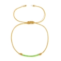 Handmade gold cord bracelet featuring lime green cylinder beads and adjustable flat knot - Lime Green Beaded / Gold
