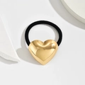 Polished gold heart charm hair tie with high elastic black rope on white stone blocks - Heart Gold