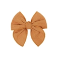 Detail of rust red linen bow hair clip showing textured fabric and scalloped lace edges - Orange Brown