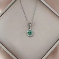 Luxurious stainless steel necklace with green zircon round pendant on silk - Silver Green Zirconia