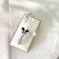 Silver-plated twisted bangle featuring white pearls and a micro-pave zircon butterfly - Black