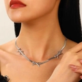 Silver bow pendant choker necklace in stainless steel on female model neck - Silver Bow Snake Chain Necklace (N-1044)
