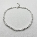 Detailed macro view of irregular silver shards necklace with adjustable lobster clasp - Necklace / Silver Plated Hematite