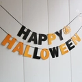 Detail of Happy Halloween paper banner with black and orange swallowtail flags for party - Halloween Black and Orange Letters