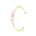 Detail of handmade gold wire-wrapped bracelet featuring three raw amethyst stones - Violet