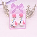 Cute pink unicorn clip-on earrings for kids with colorful mane on a pastel card - Unicorn