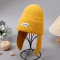 Winter yellow knit earflap beanie featuring a stylish ShortSentence label for women - Yellow