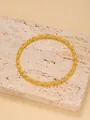 Elegant gold twisted rope bangle with a polished spiral design on a stone texture - 6cm-1pc