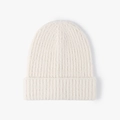 Thick ribbed knit beanie in cream white featuring soft feather yarn for winter warmth - Beige