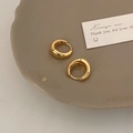 Detailed view of polished golden huggie earrings with a reflective mirror finish - Gold 17mm (Medium)