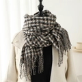 Classic British plaid scarf in brown and white with fringe on a white coat - Black