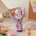 Handmade knitted yarn flower bouquet in purple wrap with white ribbon and colorful blooms - Purple