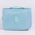 Light blue hanging toiletry bag made of durable nylon for travel storage - Korean Blue