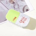 Macro detail of chill pill capsule hair claw clip with glitter finish and text - Green Pill