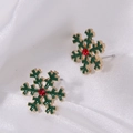 Green and gold snowflake earrings with red crystal stud on white silk background - Green Snowflake