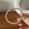 Elastico per capelli intrecciato color tè al latte con chiusura marrone resistente - Cachi