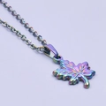 Macro shot of rainbow-colored maple leaf pendant on stainless steel chain link - Rainbow (Necklace)