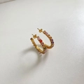 Detailed close-up of golden hoop earrings with multi-colored square zircon stones on a white background - Multicolor (DEK1085)