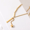 Gold titanium steel tassel necklace with letter I pendant and 3D cube on white surface - Gold Initial I (8847)