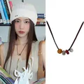Neue chinesische Vintage-Perlenkette mit brauner Kordel und Retro-Silberanhänger für Damen - Halskette-Kaffee