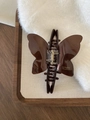 Brown butterfly hair claw clip with acetate glossy finish and handmade logo detail - Dark Brown Texture