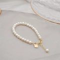 Elegante bracciale di perle d'acqua dolce con ciondolo dorato Good Luck su seta - Bracciale di Perle Tonde da 6MM